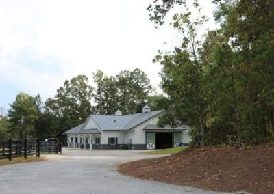 Equestrian stable with modern facilities and scenic surroundings.