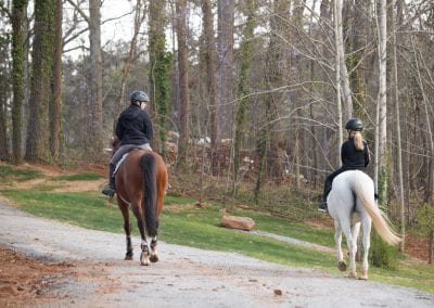 Horseback riding scenic trail in wooded area at Millstone Stables.