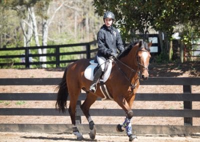 Horseback riding lesson at Millstone Stables, outdoor riding arena.